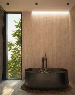 a large black bath tub sitting in a bathroom next to a window