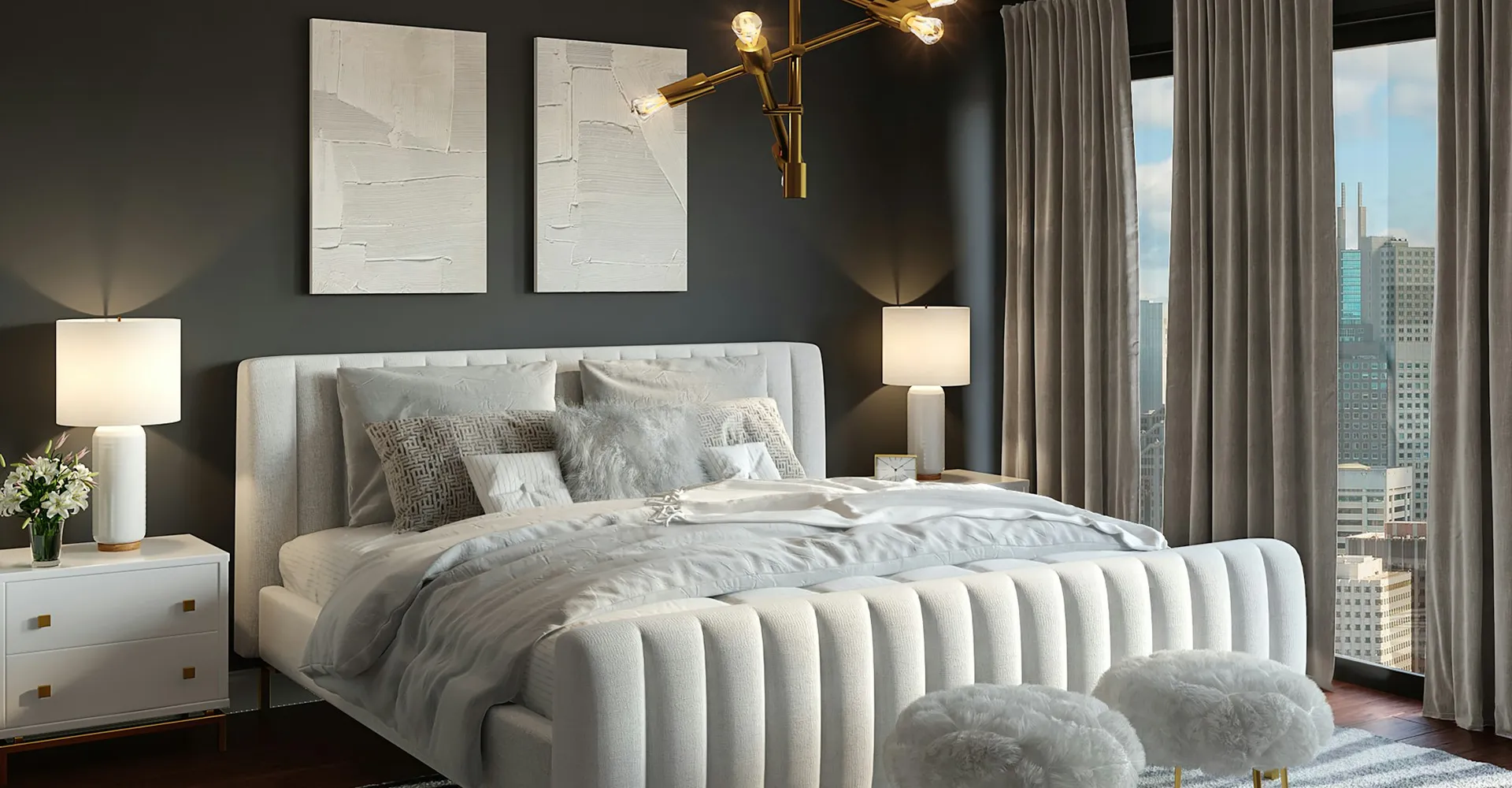 A modern bedroom with a white upholstered bed, gold chandelier, and city view