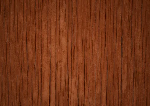 A close-up of dark brown wood grain with vertical cracks