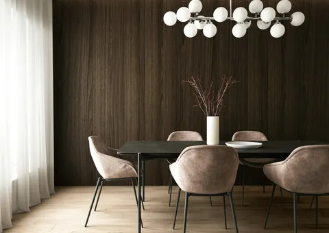 a room with a table chairs and a plant with lights