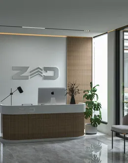 a reception desk with a laptop on top of it