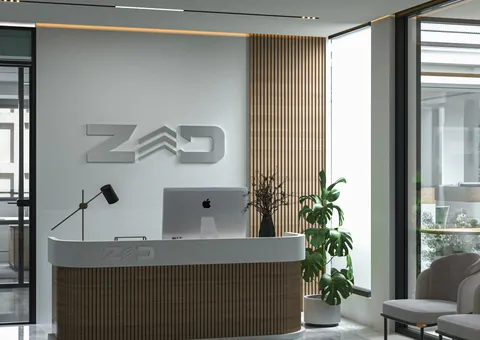 a reception desk with a laptop on top of it