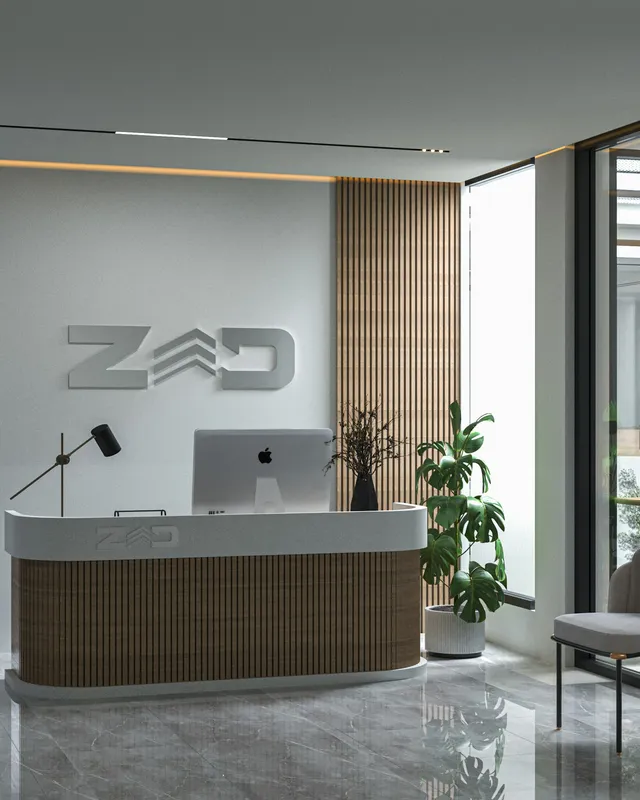 a reception desk with a laptop on top of it