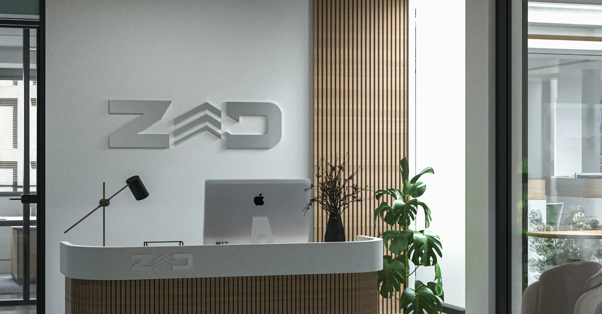 a reception desk with a laptop on top of it