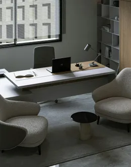 a reception desk with a laptop on top of it — detail 1